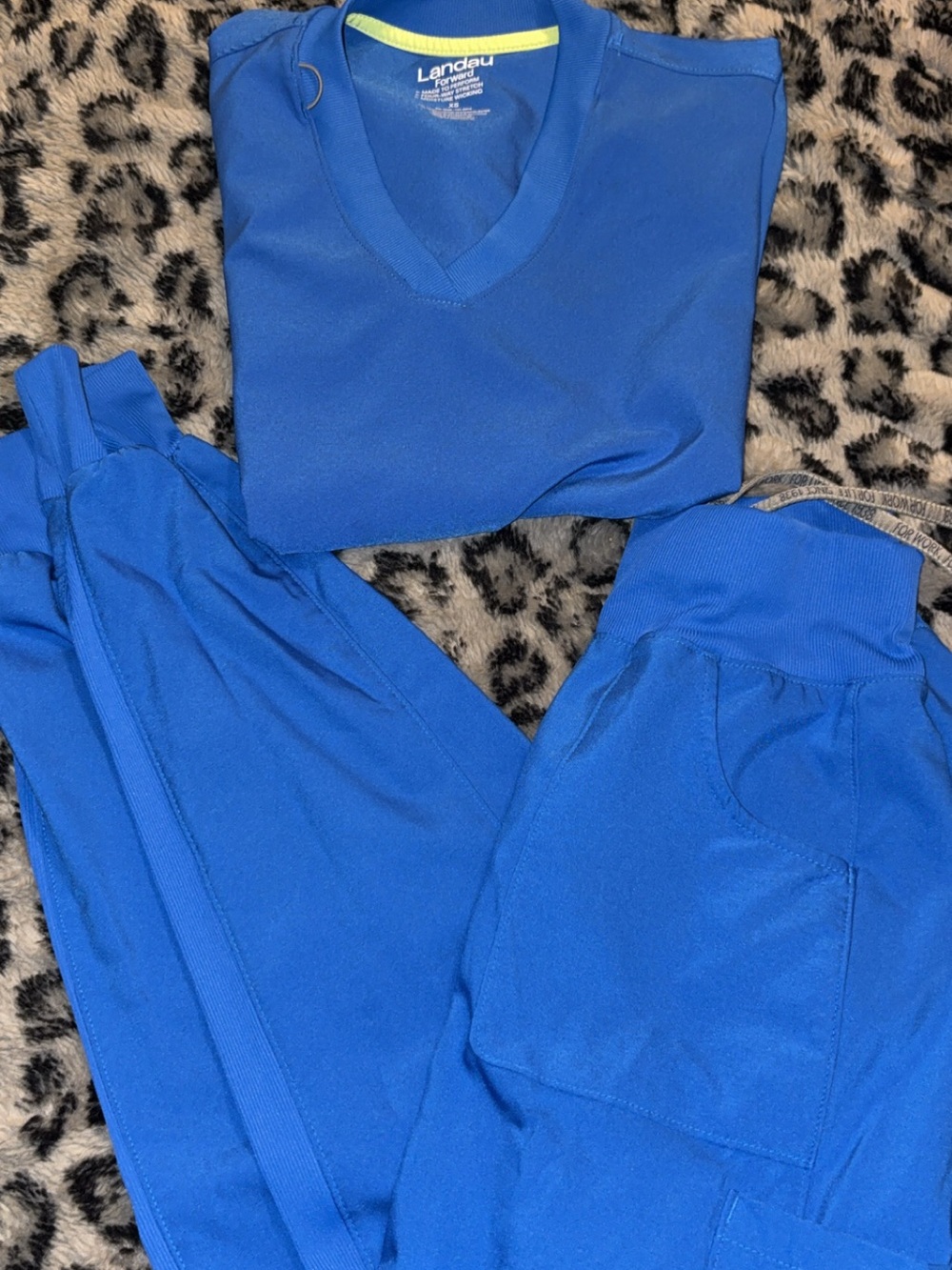 Landau royal blue scrubs. Bottoms are joggers. Super soft and stretchy.